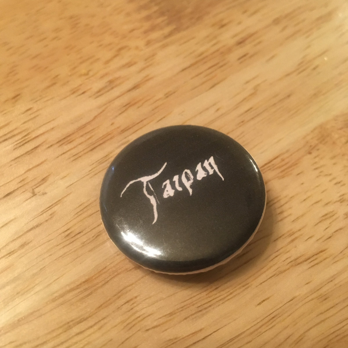 Tarpan button